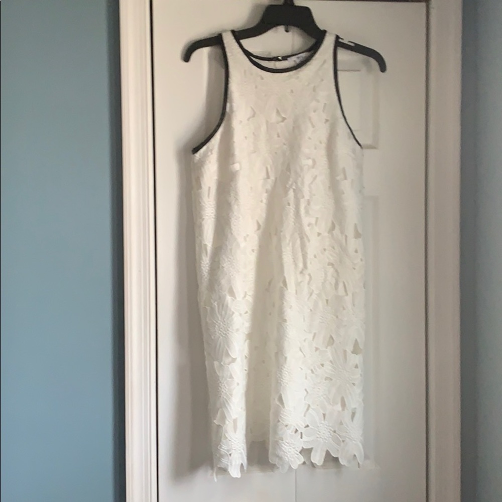 White lace dress with leather trim detail